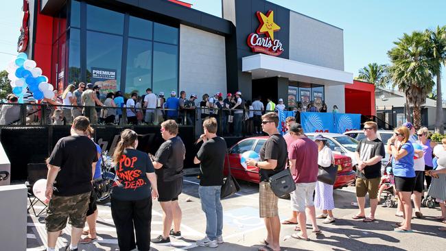 Customers queue at the opening day of business for the first Carl's Jnr to launch in Australia, at Bateau Bay. Picture: Troy Snook