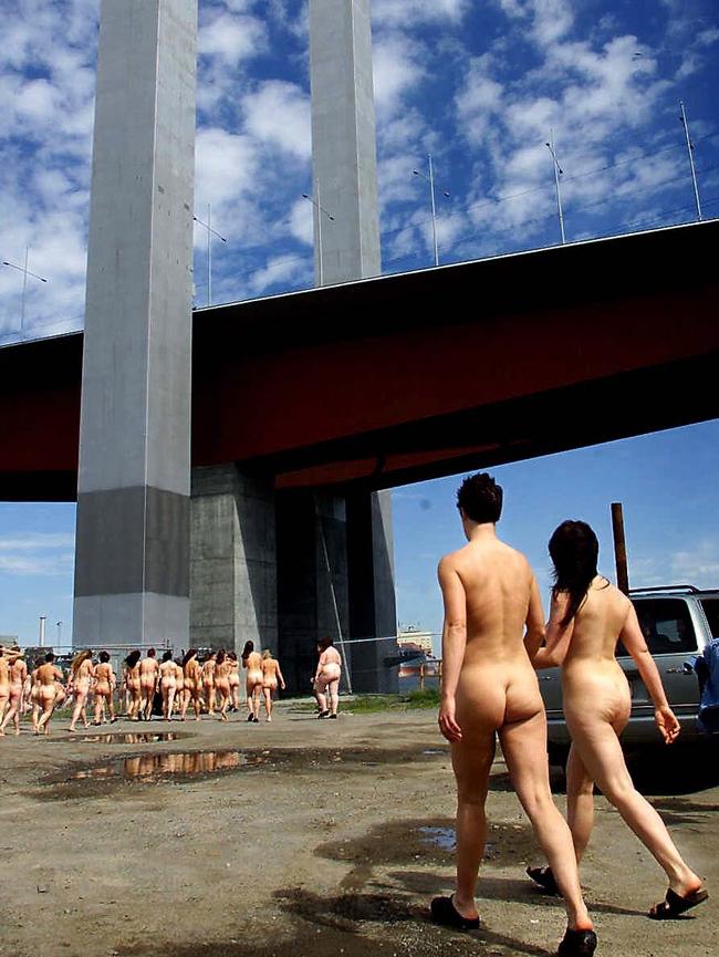 Photo subjects prepare for a Spencer Tunick shoot at the Bolte Bridge.