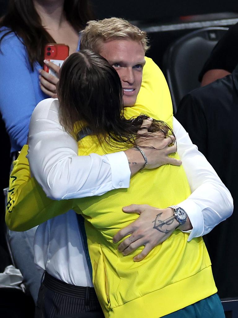 The couple embraced after her gold medal. Picture: Quinn Rooney/Getty Images