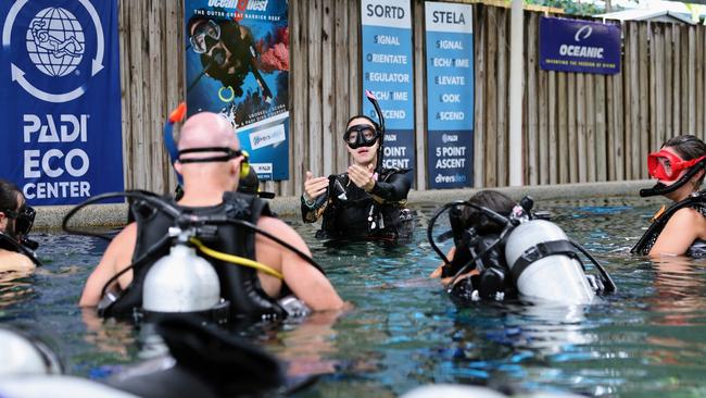 Cairns' oldest scuba diving business and diver training centre, Diver's Den, is celebrating 50 years of operation. Diving Instructor Momo Steele puts students through skills training for their Open Water Diver certification at the Diver's Den training pool. Picture: Brendan Radke