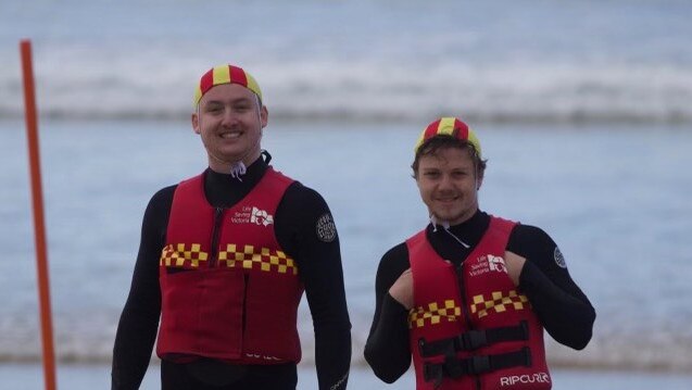 Aidan Hurst on the left patrolling the beach with mate David Morris.