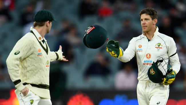 Australia's captain Tim Paine throws a helmet towards Steve Smith during first Test against India last December Picture: AFP