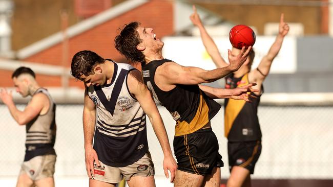 Tom Schnerring of Heidelberg celebrates on the final siren. Photo: Hamish Blair