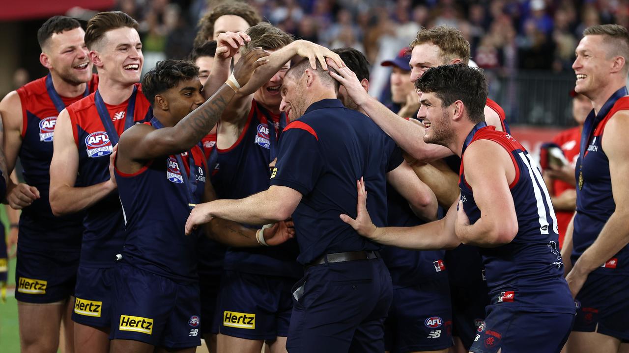 Melbourne players mob premiership coach Simon Goodwin. Picture: Michael Klein