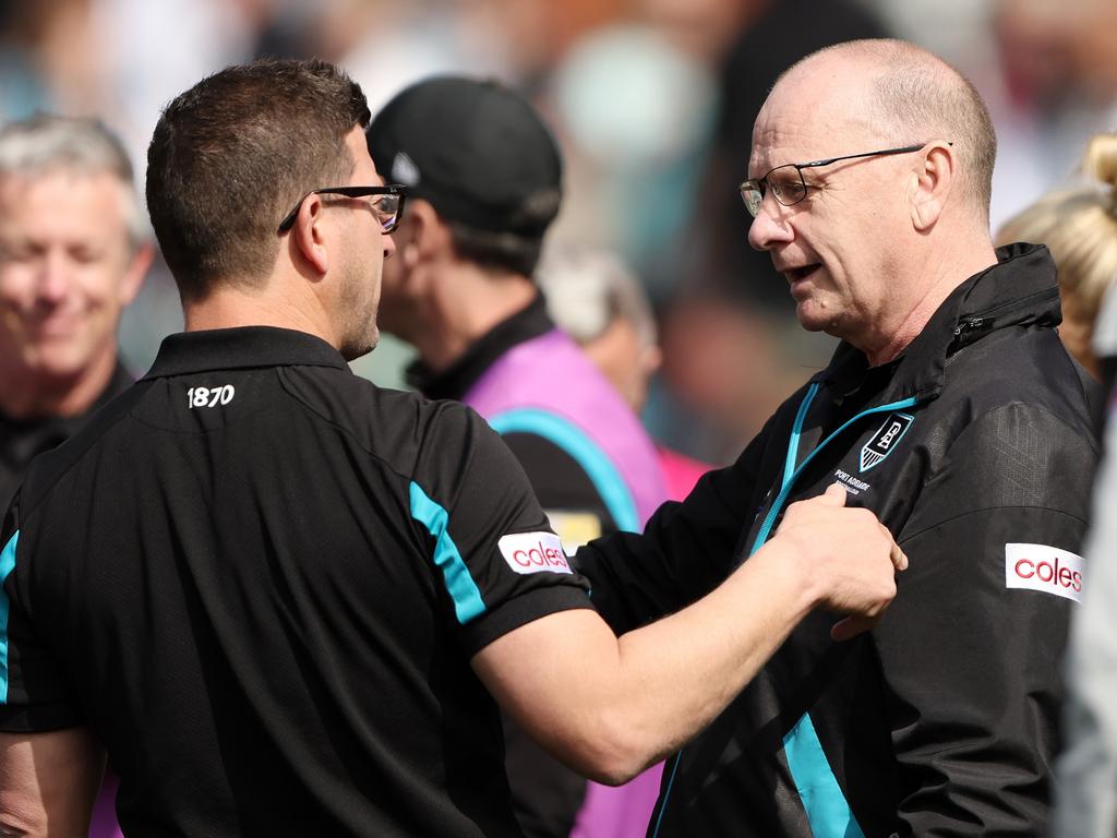 Josh Carr and Ken Hinkley at work. Picture: Sarah Reed/AFL Photos