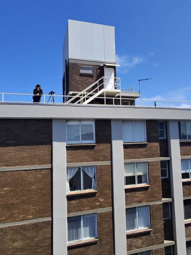 Screenshots from Max Pollard's Instagram post show police on a roof.