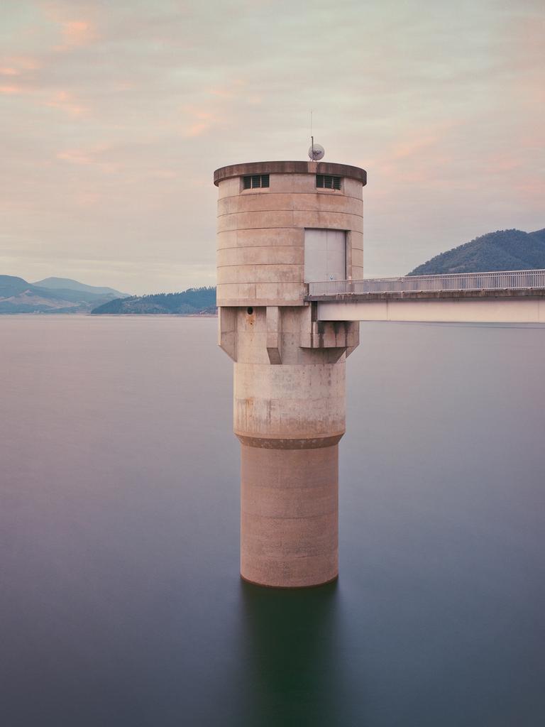 Image Name: Intake tower, Blowering Reservoir NSW, Australia Photographer Name: Chris Round Year: 2018 Image Description: This image is part of an ongoing project concerning the Snowy Hydro Scheme and the Snowy Mountains region in NSW. It’s an exploration of the balance between nature and man’s intervention upon it - vast structures amongst epic landscapes, re-shaped waterways and newly created ones. This is the Blowering Reservoir intake tower taken in the early morning light, using a Pentax 67 medium format camera and Portra160NC film. The brutalist structure creates an interesting juxtaposition with the surrounding environment and the soft-looking water – a result of the need for a long exposure. Copyright: Chris Round, Australia, Commended, Open Architecture and Winner, Australia National Award. Picture: Sony World Photography Awards/ Chris Round
