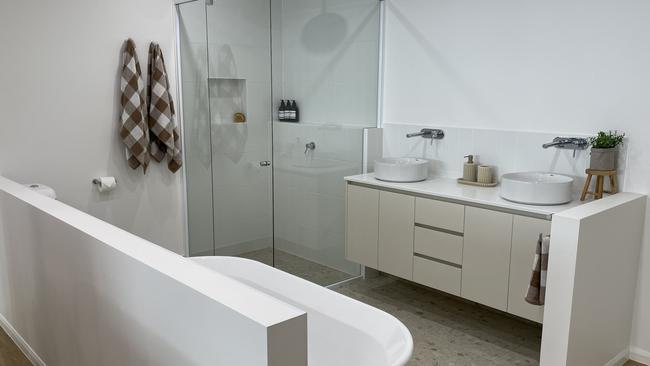 The Stroud Homes office are complete with a room filled with tile samples, colour swatches, a sample kitchen and bathroom area. Photo: Fergus Gregg