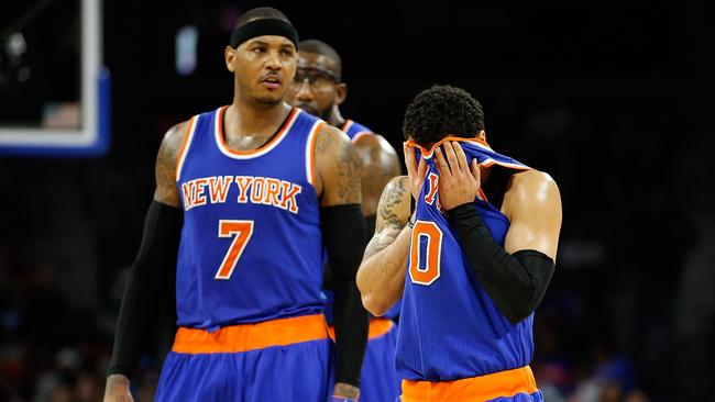 Shane Larkin next to Carmelo Anthony while playing the Detroit Pistons.