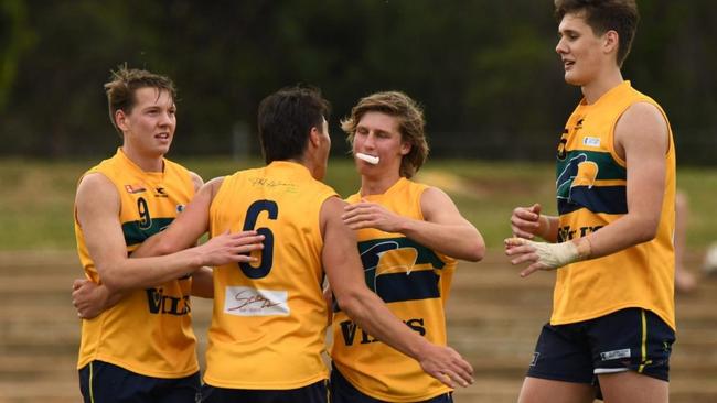 Eagles' Max Litster (left) celebrates a goal for the reserves. His performances for his club and for SA earned him major recognition from the SANFL. Picture: Hannah Howard/SANFL