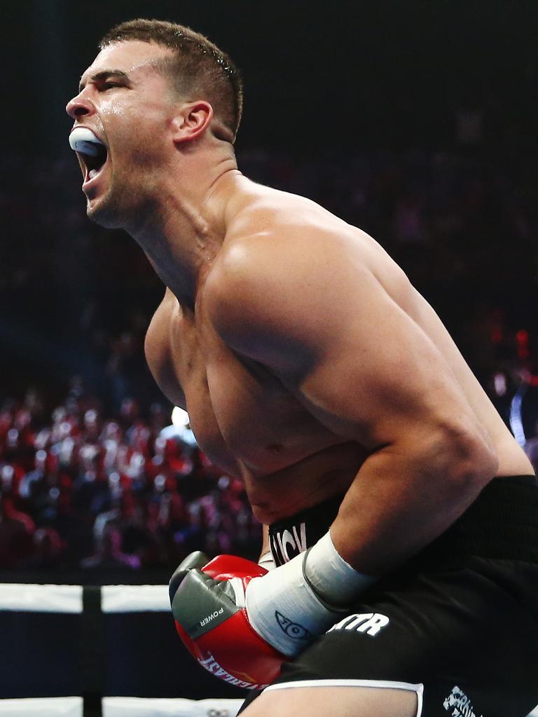 Darcy Lussick celebrates winning his Heavyweight undercard fight over former NRL player Justin Hodges. AAP Image/Brendon Thorne.