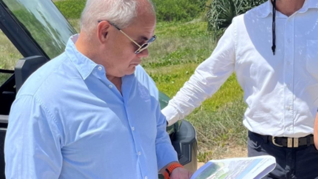 Mayor Tom Tate with Gold Coast City Council engineers checking where sections of the Oceanway would be built.