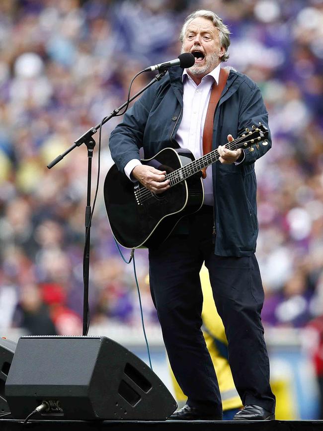 Mike Brady performs at the 2013 AFL Grand Final. Picture: Michael Klein