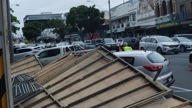The collapse damaged cars with one pedestrian lucky to avoid injury. Photos: Shaun Viljoen.