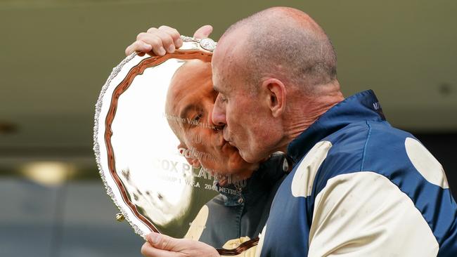 Glen Boss kisses the Cox Plate after winning aboard Sir Dragonet. Picture: Racing Photos via Getty Images