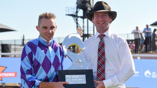 Jockey Declan Bates and trainer Ciaron Maher a with the All-Star Mile trophy. Picture: George Sal/Racing Photos via Getty Images