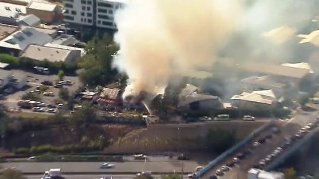 Aerial photos of the fire in a home adjacent to the South East Freeway at Woolloongabba. Picture: 7 News