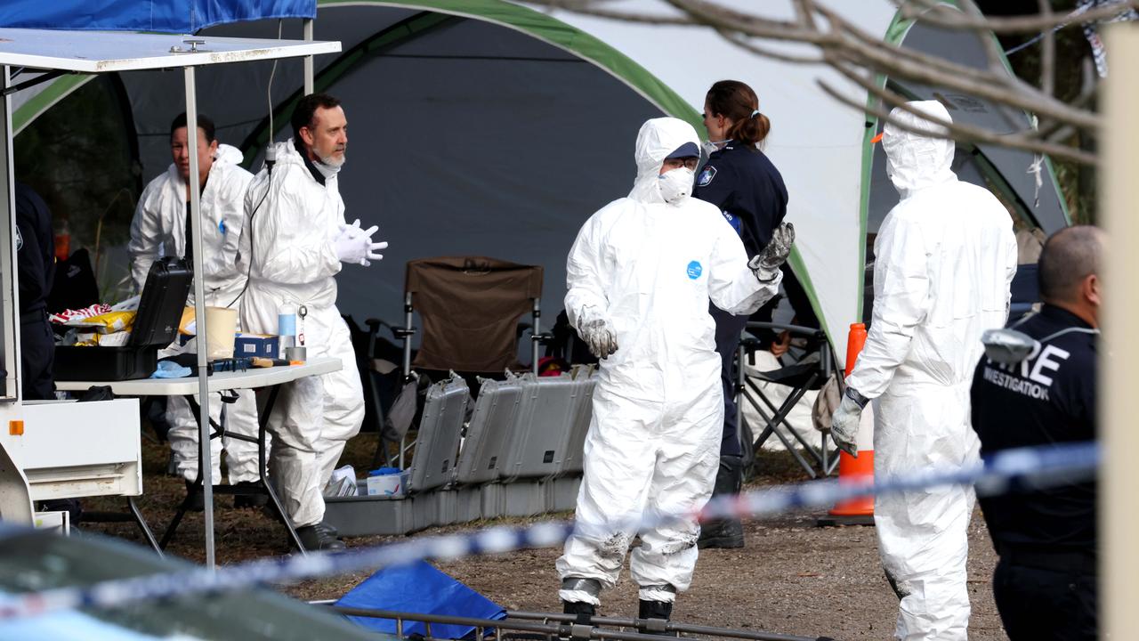 Forensics officers at the scene on Monday. Photo Steve Pohlner