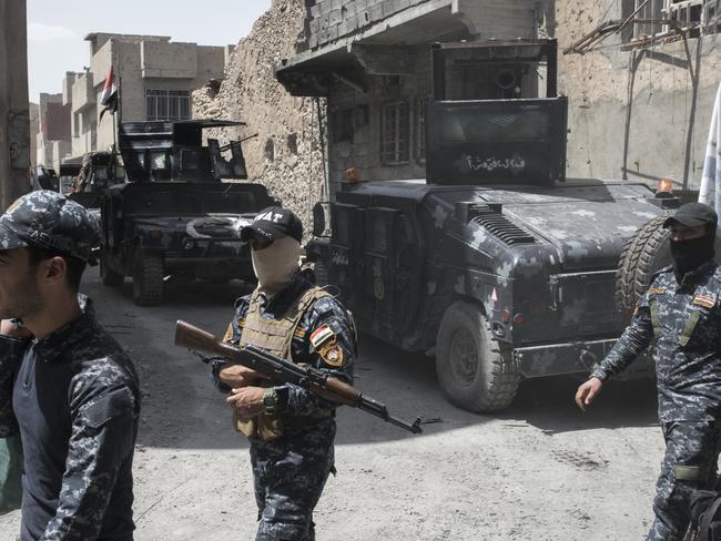 Iraqi Federal Police command and soldiers pictured on the frontline against Islamic State in Adedat, a neighbourhood in the Old City of west Mosul, the last area of the city under IS control. Picture: Martyn Aim/Getty Images