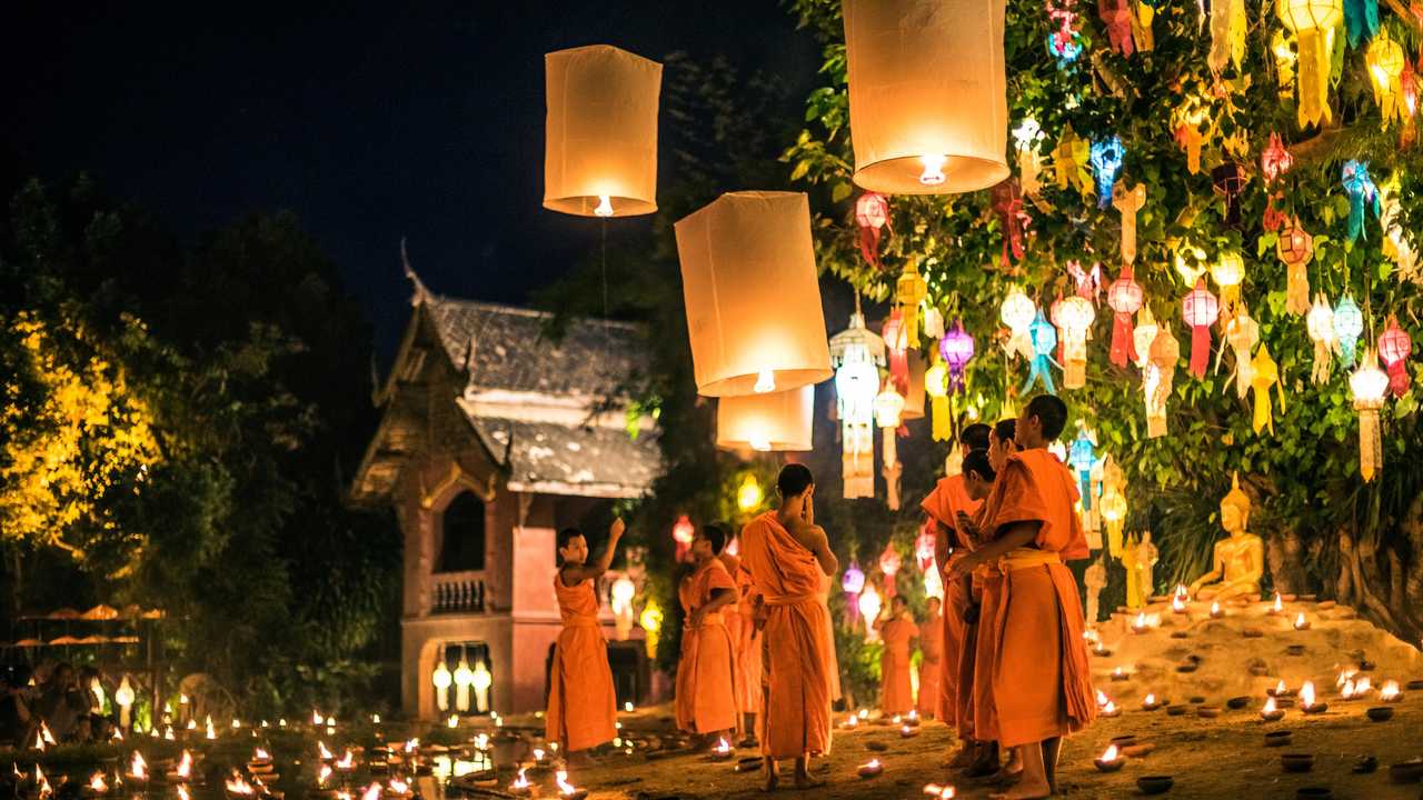 Traditional monk lights floating balloon made of paper annually at Wat Phan Tao temple during the Loi Krathong Festival in Chiang Mai. Picture: yupiyan