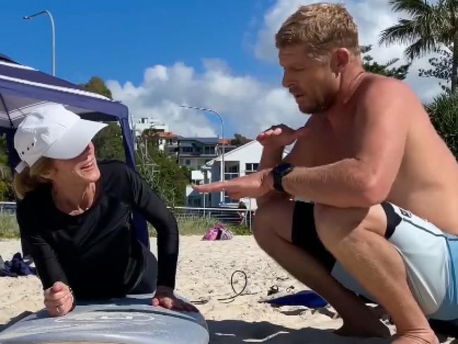 U.S. Ambassador to Australia, Caroline Kennedy, in Queensland, getting a surf lesson from World Champion Mick Fanning. Picture: Twitter/@USEmbAustralia