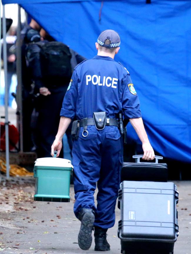 Forensic officers at Surry Hills. Picture: John Grainger