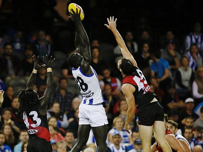 Majak Daw towers above the Essendon defence. Picture: George Salpigtidis