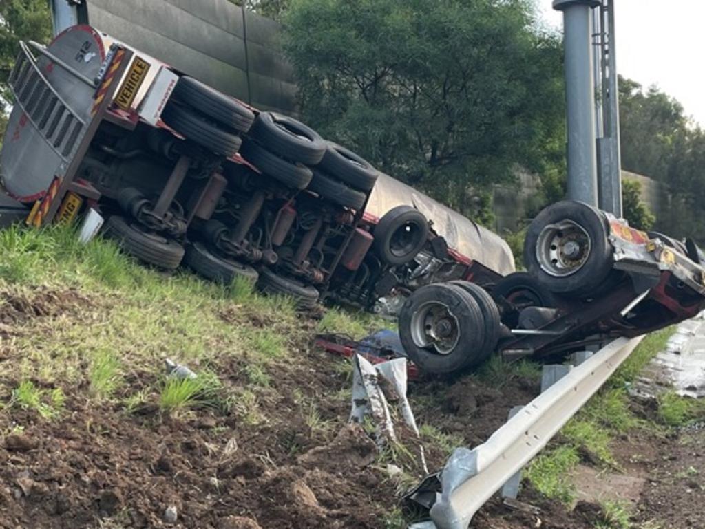 Traffic on a major Sydney highway has been thrown into chaos after a truck full of milk swerved off the road and hit an embankment. Picture: Supplied
