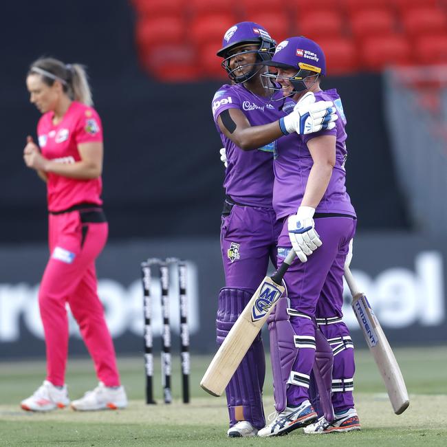 Hurricanes' Hayley Matthews and Rachel Priest celebrate victory during the WBBL match between the Sydney Sixers and Hobart Hurricanes at the Sydney Showground. Picture: Phil Hillyard