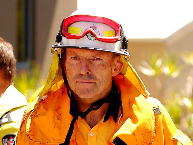 Former Australian Prime Minister Tony Abbott pictured whilst helping fight a blaze at Castle Cove in Sydney today.