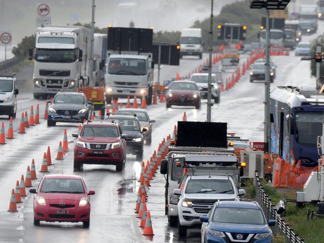 Geelong-bound traffic goes through a checkpoint on the Princes Freeway at Little River. Picture: Andrew Henshaw