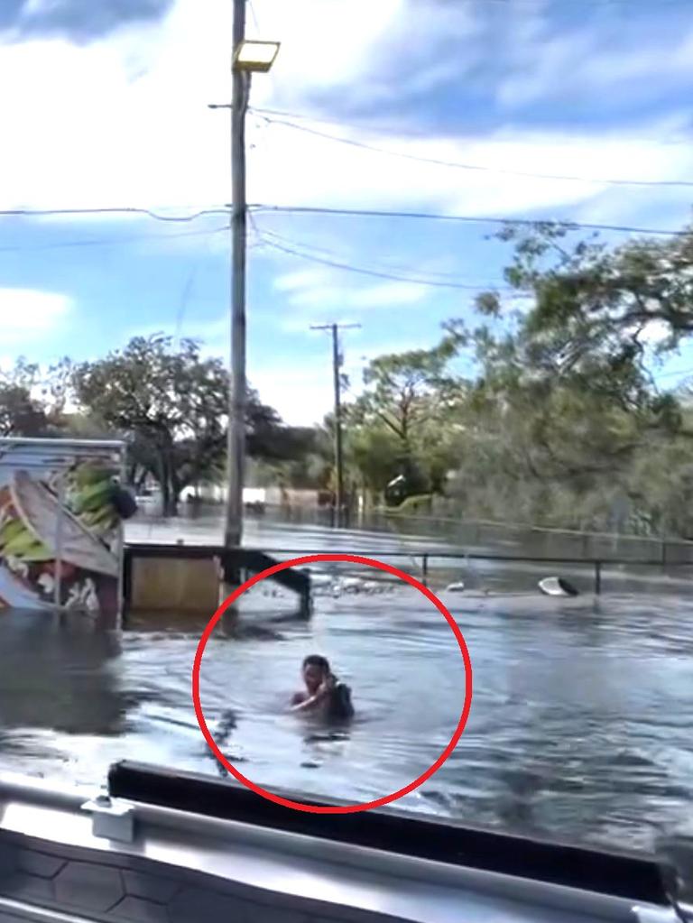 The 14-year-old is seen swimming from the plank he was clinging to in Tampa. Picture: Hillsborough County Sheriff.