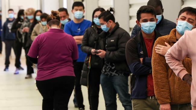 Aged care and disability care workers line up for their vaccine at the Melbourne Showgrounds. Picture: NCA NewsWire / Ian Currie