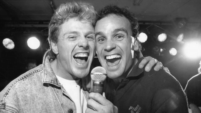 Michael Aish (right) singing with Dermott Brereton.