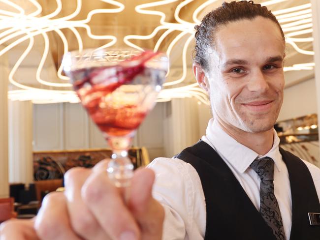 ADELAIDE, AUSTRALIA - NewsWire Photos October 23 2023: Bar Supervisor Thomas holds a cocktail at Bar Luma. Adelaide bar Luma named best designed bar in the world at international competition in London. NCA NewsWire / David Mariuz