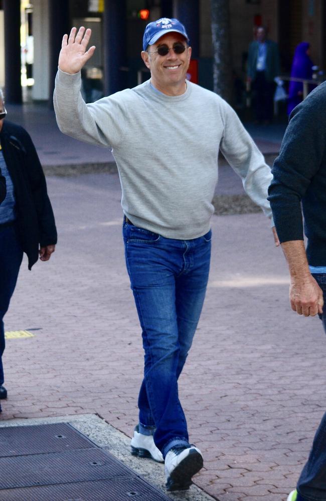 Wonder if those white sneakers were cleaned at the Mom and Pop Store? Jerry Seinfeld goes for stroll with a friend around Olympic Park. Picture: Mega