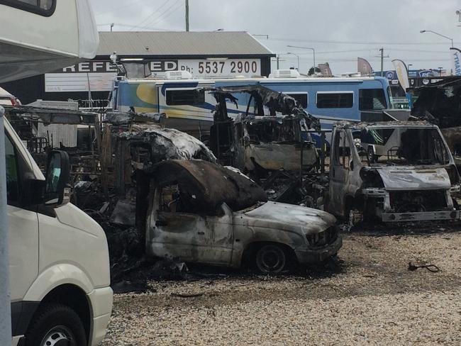 Motorhomes have been destroyed at an Arundel car yard after fire guttered them. Photo: Nicholas McElroy