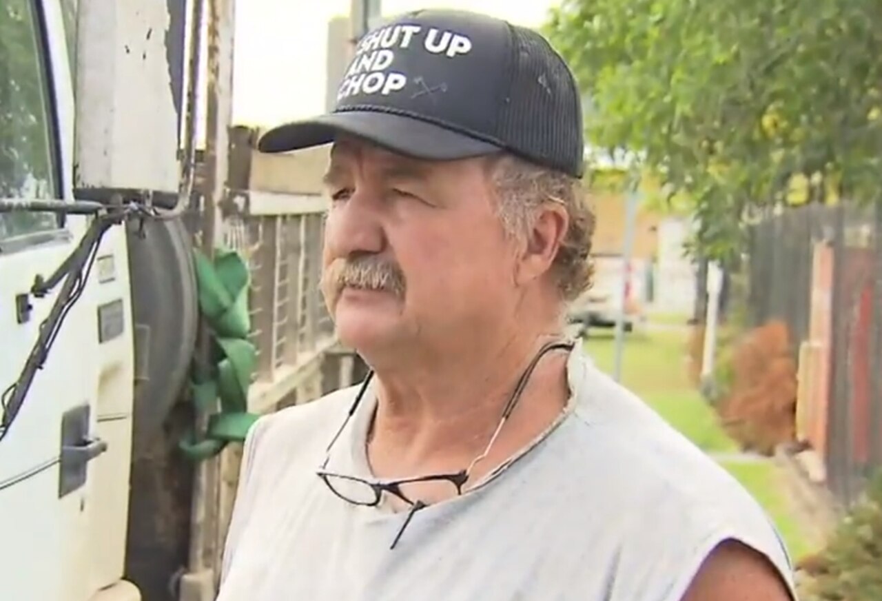 Queensland truckie Gary Jones has been hailed a hero after pulling an elderly man from his burning car on the Gold Coast. Picture: 9 News