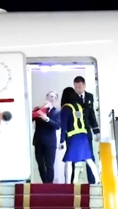 Wild moment French President has face shoved by First Lady