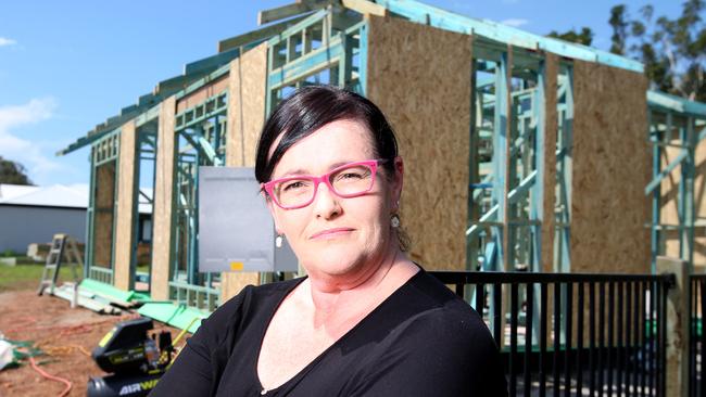 Felicity Cameron at her partially completed home. The single mother is living in rental accommodation with her teenage daughter after the collapse of PlanBuild.