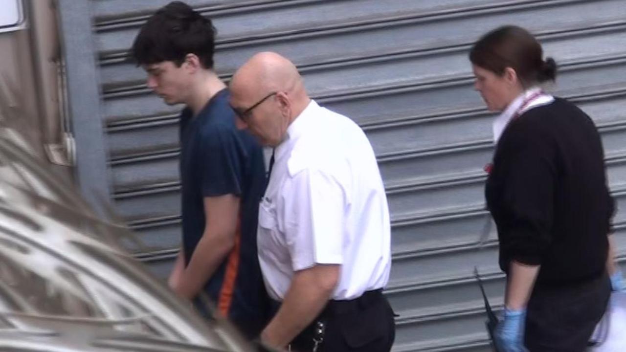 Ashra Stuart, 18, of Windsor Gardens, left, is led into Adelaide Magistrates Court. Picture: 7NEWS