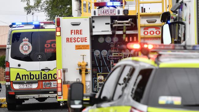 Paramedics with man after garbage truck hits power lines