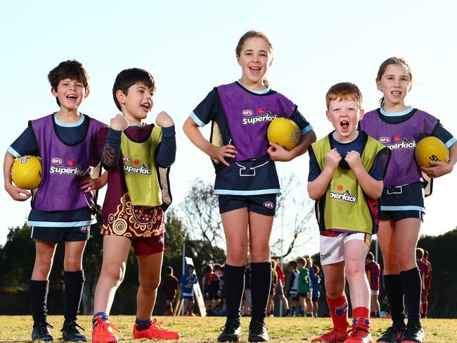 MELBOURNE, AUSTRALIA - MAY 24: Alexandra Ferreira, 7, Thomas Papalas, 6, Ella Evans, 7, Hamish Saddington-Smith, 7, and Poppy Evans, 7 pose during a Superkick Clinic Media Opportunity at Murrumbeena Superkick Centre on May 24, 2025 in Melbourne, Australia. (Photo by Morgan Hancock/AFL Photos)