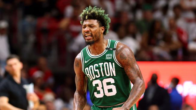 MIAMI, FLORIDA - MAY 19: Marcus Smart #36 of the Boston Celtics reacts after a three point basket during the fourth quarter against the Miami Heat in Game Two of the 2022 NBA Playoffs Eastern Conference Finals at FTX Arena on May 19, 2022 in Miami, Florida. NOTE TO USER: User expressly acknowledges and agrees that, by downloading and or using this photograph, User is consenting to the terms and conditions of the Getty Images License Agreement. Michael Reaves/Getty Images/AFP == FOR NEWSPAPERS, INTERNET, TELCOS &amp; TELEVISION USE ONLY ==