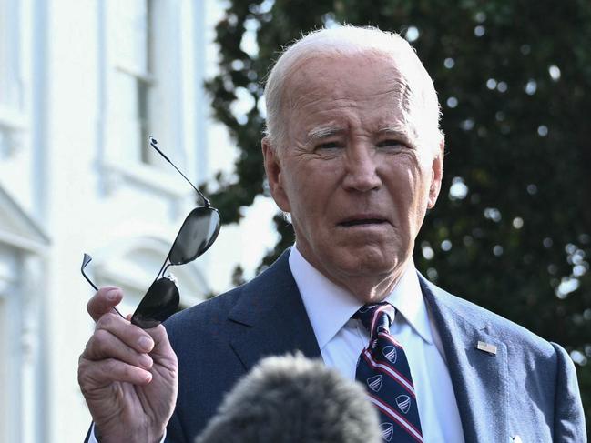 US President Joe Biden speaks to the press before boarding Marine One as he departs the White House in Washington, DC, on September 16, 2024. (Photo by Brendan SMIALOWSKI / AFP)