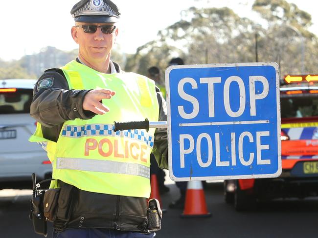 Embargoed for The Saturday Telegraph.RBT on Burns Bay Road near Hunters Hill.Sergeant Milner directing traffic.Random breath testing started in 1982. Since then, trauma from fatal crashes involving alcohol has dropped from about 40 per cent of all fatalities to the 2017 level of 15 per cent. Police conduct about 5 million breath tests each year in NSW. Every police car is a mobile RBT.