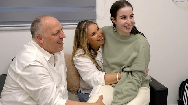 Agam Berger with her parents after her release by Hamas. Picture: AFP.