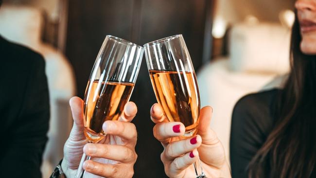 Try and retain a little class when it comes to the free flowing bubbles. Picture: iStock