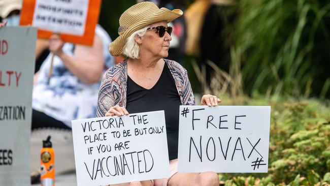 A protester outside the Park Hotel in Carlton, Melbourne, where Novak Djokovic is staying . Picture: Sarah Matray