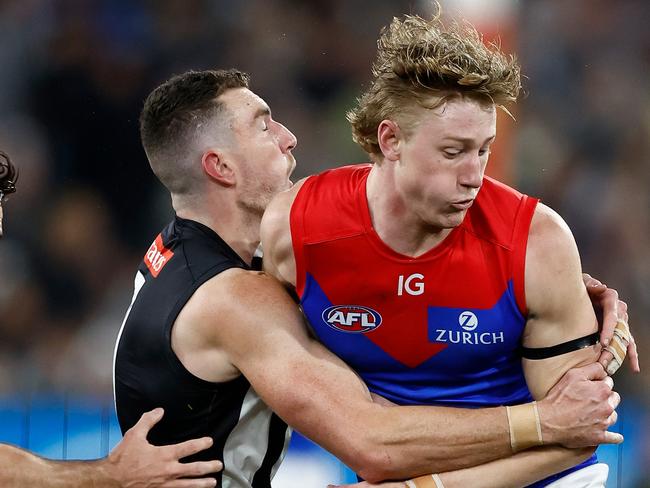 MELBOURNE, AUSTRALIA - SEPTEMBER 07: Daniel McStay of the Magpies is taken high by Jacob van Rooyen of the Demons during the 2023 AFL First Qualifying Final match between the Collingwood Magpies and the Melbourne Demons at Melbourne Cricket Ground on September 07, 2023 in Melbourne, Australia. (Photo by Michael Willson/AFL Photos via Getty Images)